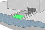 Un monticule devant l'entrée protège le garage souterrain contre les inondations.